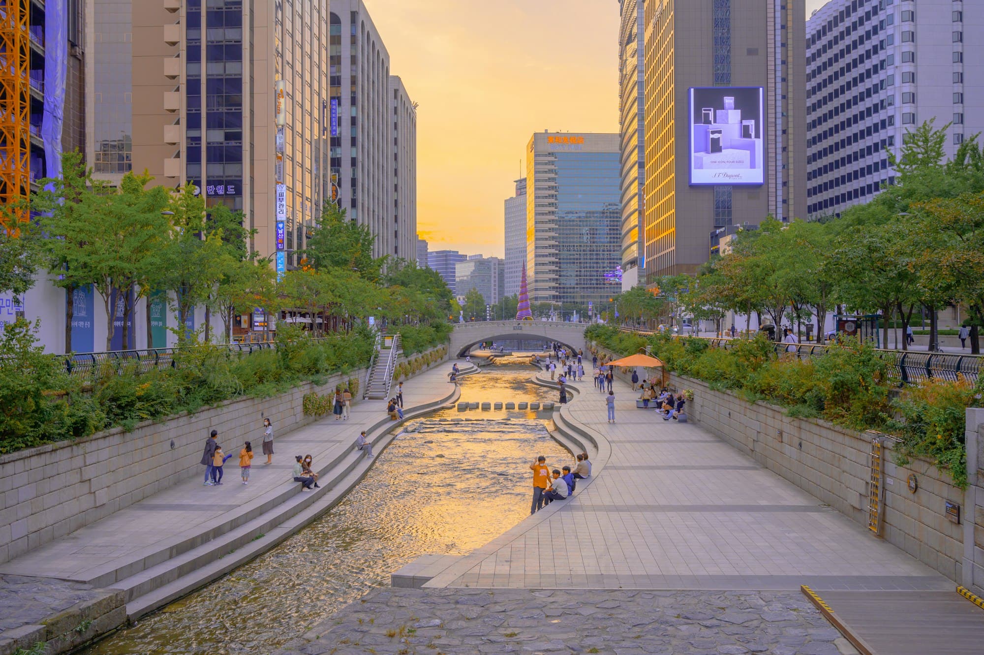 Cheonggyecheon stream through downtown Seoul at sunset