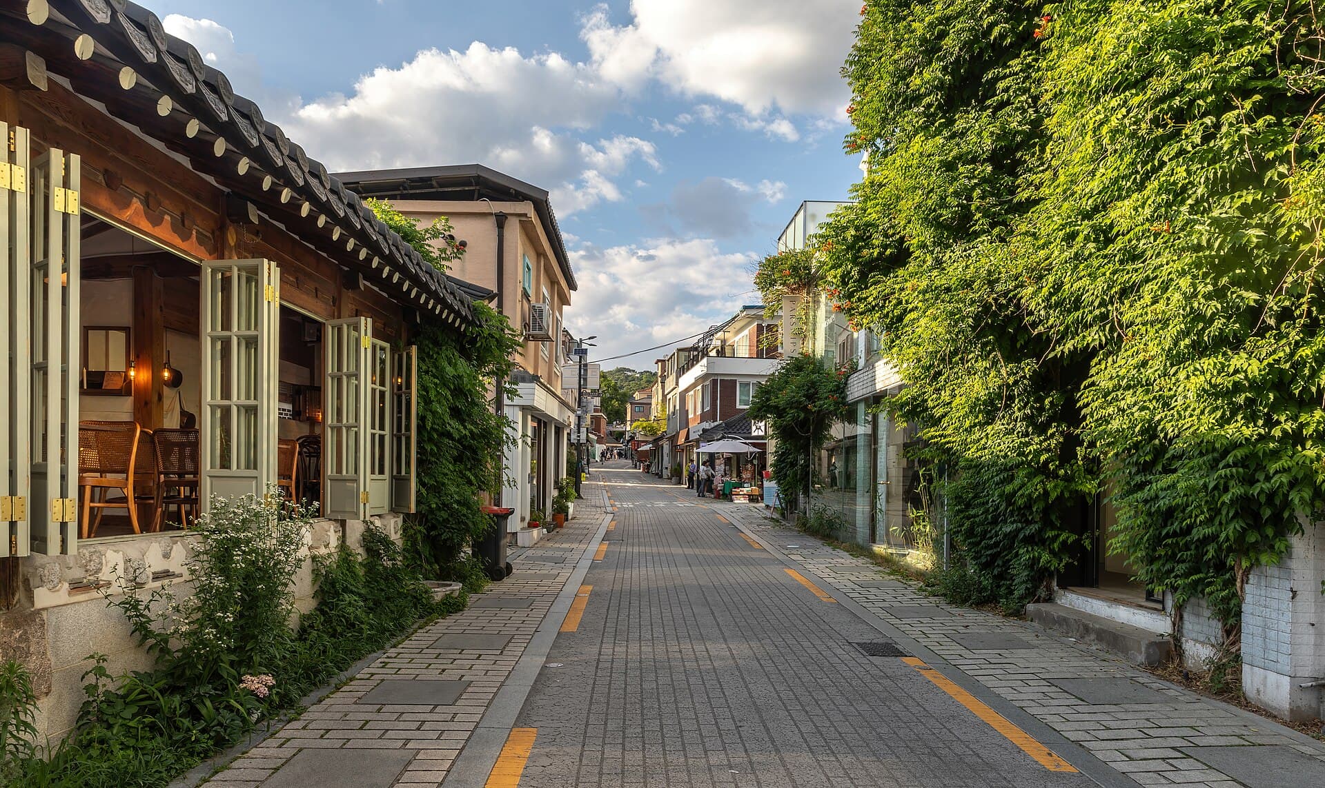 A planted lane in Gyedong, Seoul, in late-day light