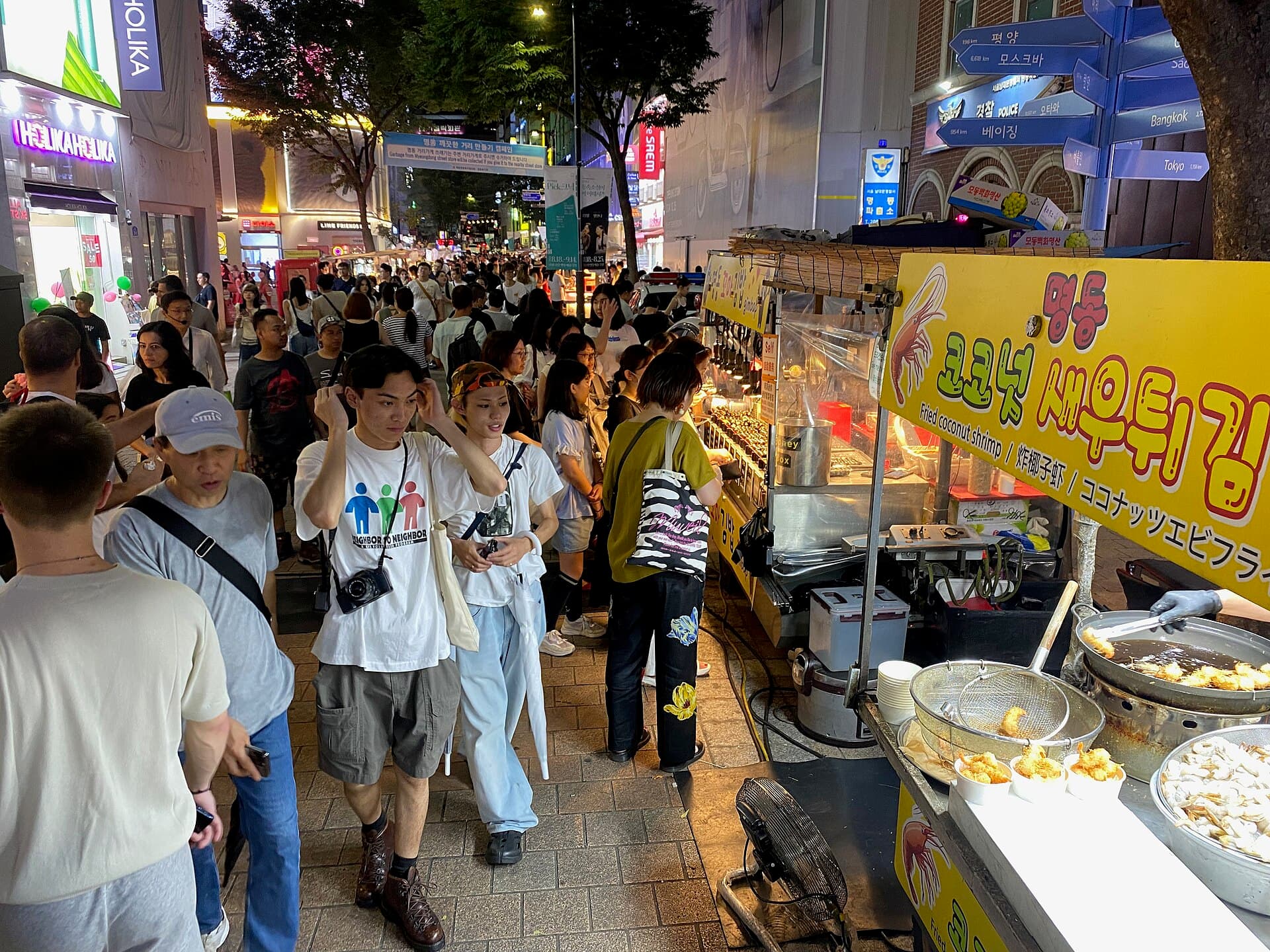 Evening street food and crowds in Myeongdong, Seoul